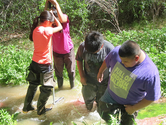Cochiti Middle School students collecting data on water quality. Share with Wildlife, New Mexico
