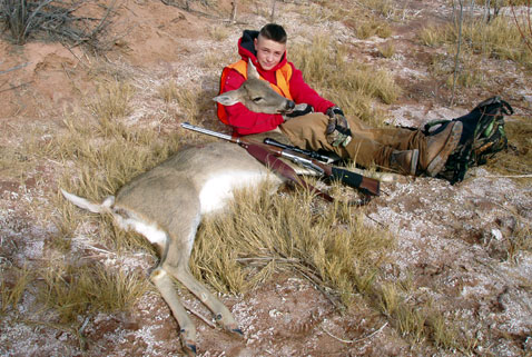 Youth with harvested white-tailed deer. New Mexico Department of Game and Fish, Open Gate private land hunts.