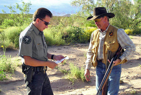 New Mexico Department of Game and Fish Conservation Officer checks for a license. (Open Gate private land hunts).